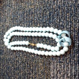 Blue beaded necklace and blue hoop clip on Earings